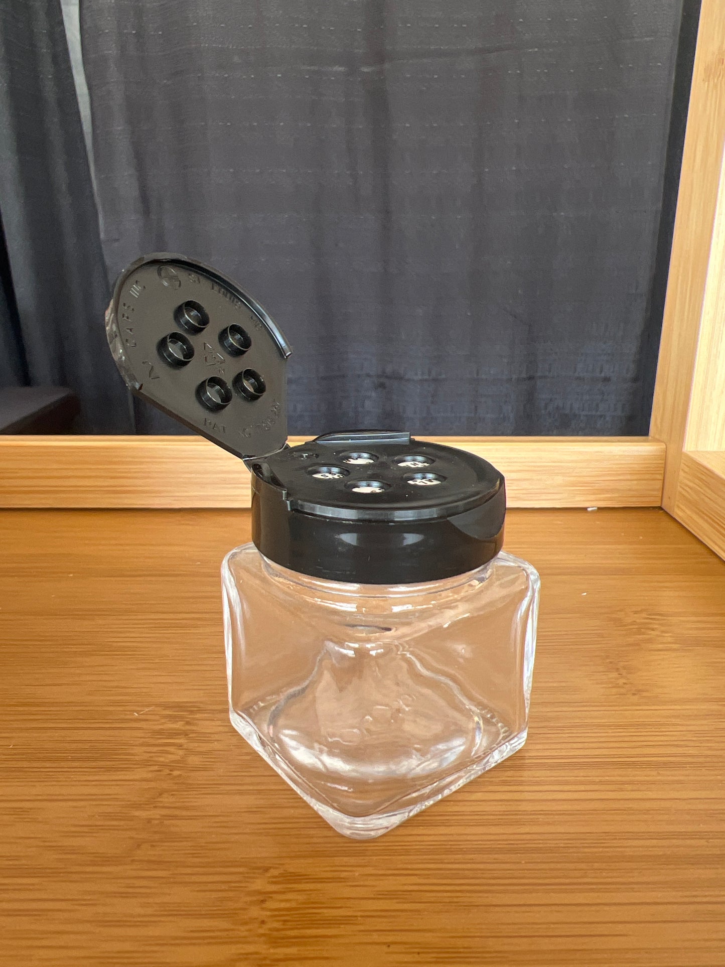 1.5 oz jar with black sifter lid